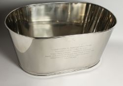A LARGE LILY BOLLINGER OVAL SILVER-PLATED WINE COOLER. 25ins long