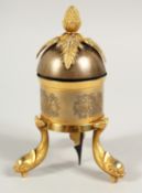 A TABLE BELL with pineapple finial on three dolphin feet. 6ins high