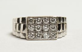AN 18CT WHITE GOLD THREE-ROW DIAMOND RING.