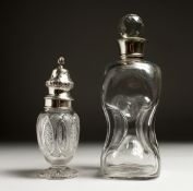 A CUT GLASS SUGAR SIFTER with silver top, Birmingham and a GLASS DECANTER AND STOPPER with a