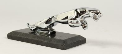 A JAGUAR CHROME CAR MASCOT. 7ins long on a marble base.
