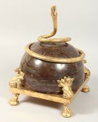 A GOOD MARBLE STAND entwined with a gilt bronze snake. 12ins high.