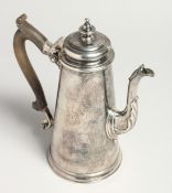 A GEORGE II TAPERING COFFEE POT AND COVER with cast spout and wooden handles. 8.25ins high with