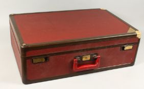 A GOOD LOUIS VUITTON RED LEATHER SUITCASE, 27ins long x 18ins wide x 9ins deep The lock numbered