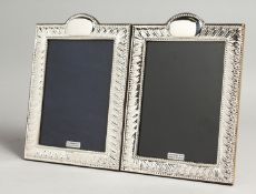 A LARGE PAIR OF SILVER PHOTOGRAPH FRAMES. 19cm x 14cm