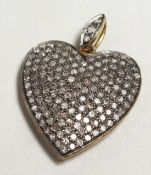 A ROSE DIAMOND HEART SHAPED PENDANT.