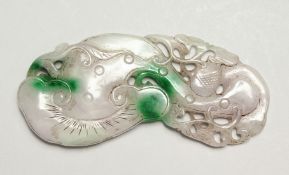 A LARGE TWO-TONE CARVED JADE PENDANT, 12cm long.