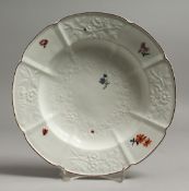 A N 18TH CENTURY CHELSEA GOTZKOWSKY TYPE SOUP PLATE moulded with flowers, with painted flowers and