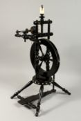 A VERY GOOD 19TH CENTURY SPINNING WHEEL with ivory buttons 29ins high.