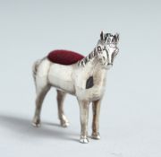 A CAST SILVER PONY PIN CUSHION.