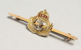 A 9CT GOLD NAVY BAR BROOCH.