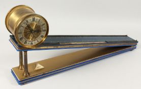 A GOOD DENT OF LONDON INCLINED PLANE CLOCK made for Geoffrey B Baker, 1973. These mystery clocks are