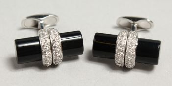 A PAIR OF 18CT WHITE GOLD ONYX AND DIAMOND CUFF LINKS