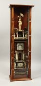 A VERY RARE AMERICAN SCRIMSHAW WATCH TOWER, with five tiers with a figure holding a watch, the
