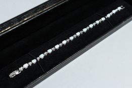 A SILVER AND GILSON OPAL LINE BRACELET.