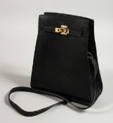 A BLACK LEATHER BAG with long leather handle. 20cm long x 25cm high.