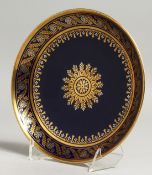 A SEVRES SAUCER SHAPED DISH decorated in platinum and gold on cobalt blue ground, blue printed mark,