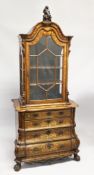A GOOD 19TH CENTURY DUTCH WALNUT AND FLORAL MARQUETRY BOMBE CABINET ON CHEST, with an unusual carved