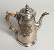 A GEORGE II COFFEE POT AND COVER with a cast spout and wooden handles. 7.25ins high, with an