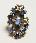 A LARGE 18CT GOLD, SAPPHIRE, AND DIAMOND RING.