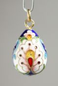 A RUSSIAN SILVER AND ENAMEL EGG PENDANT, 2.5cm.