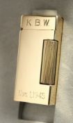 A 14CT GOLD DUNHILL LIGHTER, No. B1999, with inscription KBW, Nov. 1, 1945. in a Dunhill box.