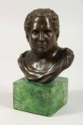 A SMALL BRONZE BUST OF THE ROMAN EMPEROR VITELLIUS on a marble base. 5ins high,