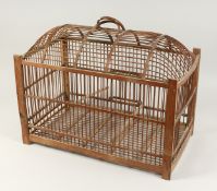 A WOODEN BIRD CAGE with carrying handle 21ins long x 17ins high.