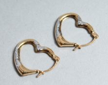 A PAIR OF 9CT GOLD HEART SHAPED EARRINGS.