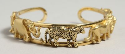 A SUPERB 18CT GOLD ANIMAL BANGLE pierced with rhino, elephant, leopard, tiger, and ox. 6cm diameter,