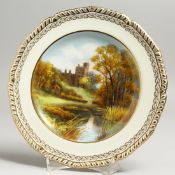 A ROYAL CROWN DERBY PLATE painted with a view of Hadden Hall, by D. Hague, signed, date mark for