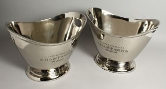 A PAIR OF OVAL SILVER-PLATED WINE COOLERS. 12ins long.