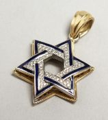 A GOLD DIAMOND AND SAPPHIRE STAR OF DAVID PENDANT.