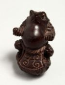 A JAPANESE CARVED WOOD FROG NETSUKE 5cm Signed.