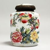 A CHINESE PORCELAIN CIRCULAR PEACH TEA JAR AND COVER.