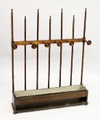 AN UNUSUAL ARTS AND CRAFTS OAK LOW HALL STAND / STICK STAND, possibly Liberty & Co., with turned