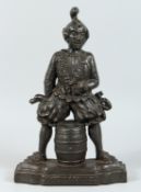 A VICTORIAN CAST IRON DOORSTOP, 'Abolition of gin' 16ins.