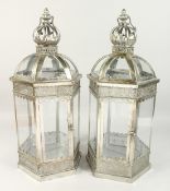 A PAIR OF HEXAGONAL SILVERED METAL LANTERNS 24ins high.