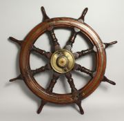 A VERY GOOD SHIP'S WHEEL with brass centre. 33ins diameter.