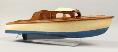 A SMALL MODEL CABIN CRUISER, cream and blue 25ins long