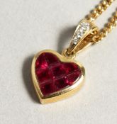 AN 18CT GOLD RUBY SET HEART PENDANT AND CHAIN.