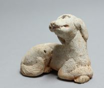 A SMALL CARVED STONE ANTIQUITY DOG. 3.5ins.