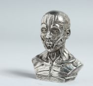 A HEAVY CAST SILVER ANATOMICAL MAN VESTA CASE.