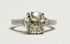 A SUPERB EDWARDIAN PLATINUM 2.78CT. CUSHION CUT SINGLE STONE DIAMOND RING,