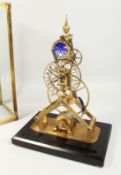 A MOONPHASE BRASS SKELETON CLOCK. 15ins high in a glass case.