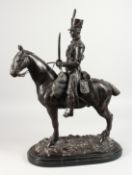 J. R. SKEAPING (1901-1980) ENGLISH A BRONZE GROUP OF A FRENCH HUSSAR ON HORSEBACK, on a marble base.