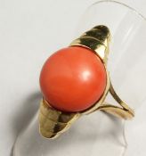 A GOLD CORAL SET RING