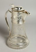 AN ETCHED GLASS AND SILVER PLATE CLARET JUG.