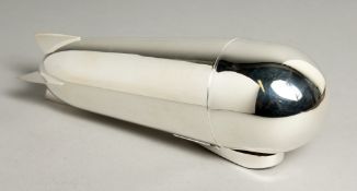 A SILVER-PLATED ZEPPELIN COCKTAIL SHAKER 9ins high.