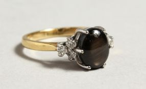 AN 18CT GOLD TIGERS EYE AND DIAMOND RING